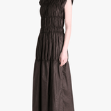 Brown dress worn by a person, side view