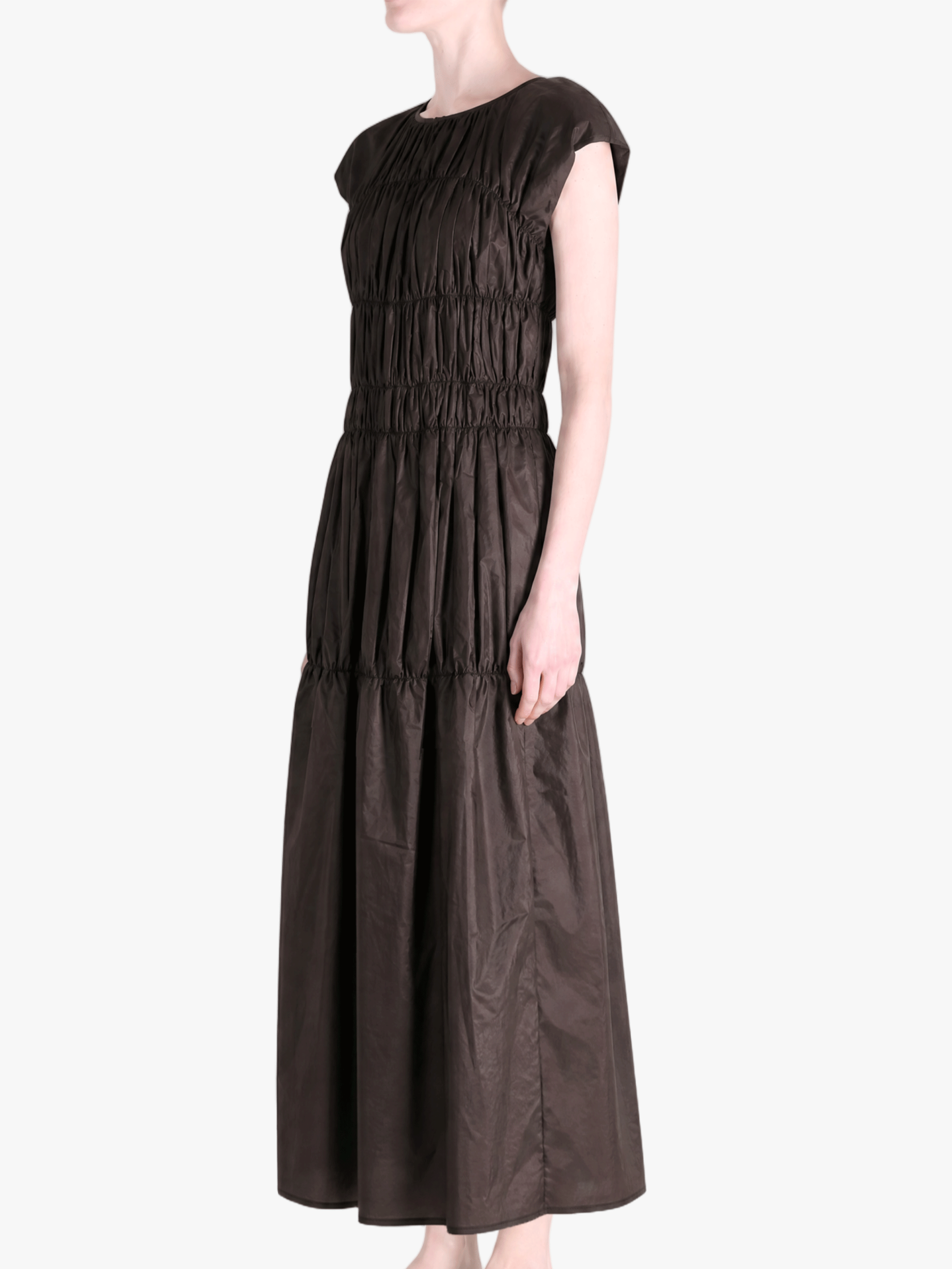 Brown dress worn by a person, side view