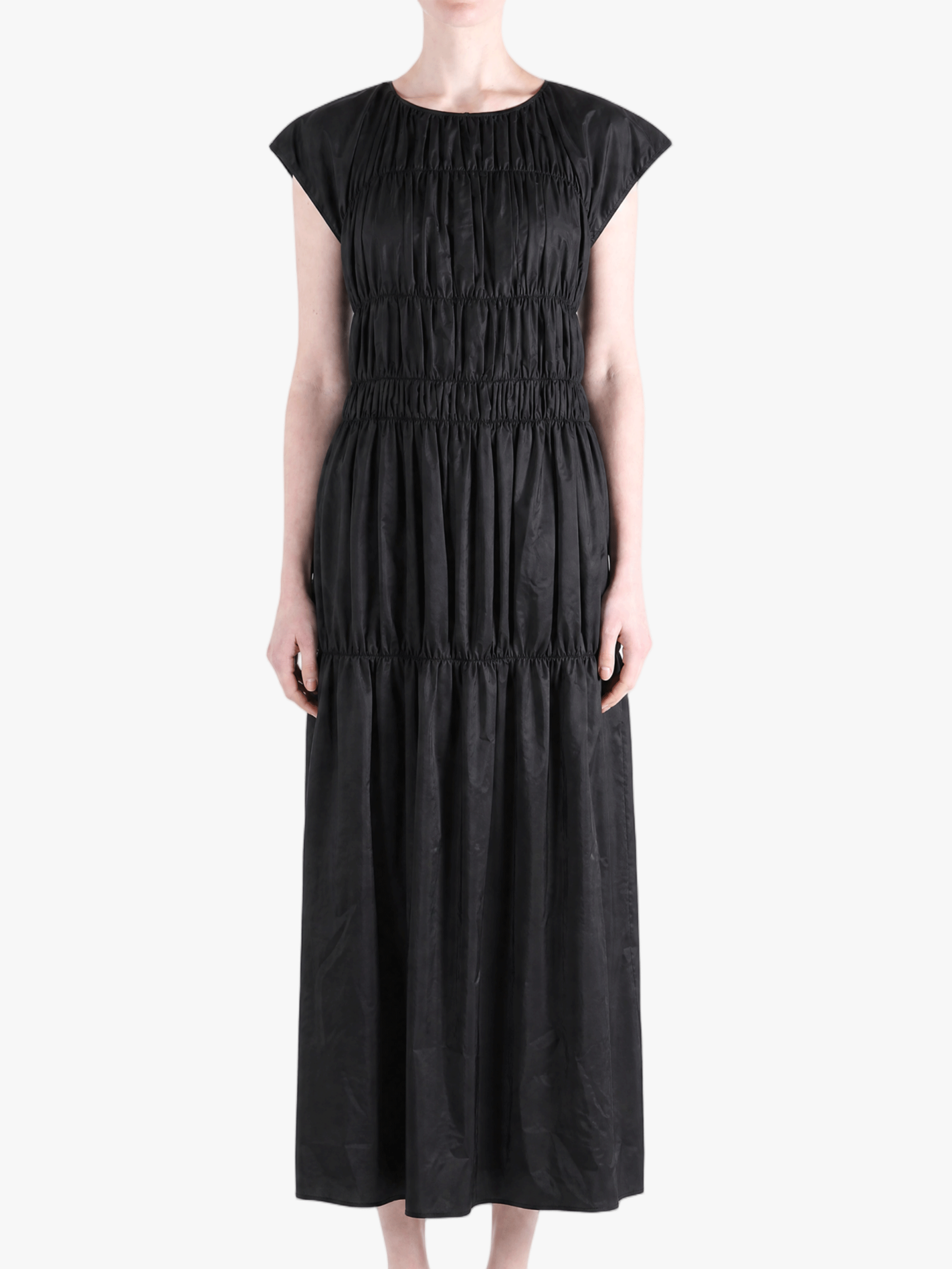 Black dress worn by a person, showing the dress fit