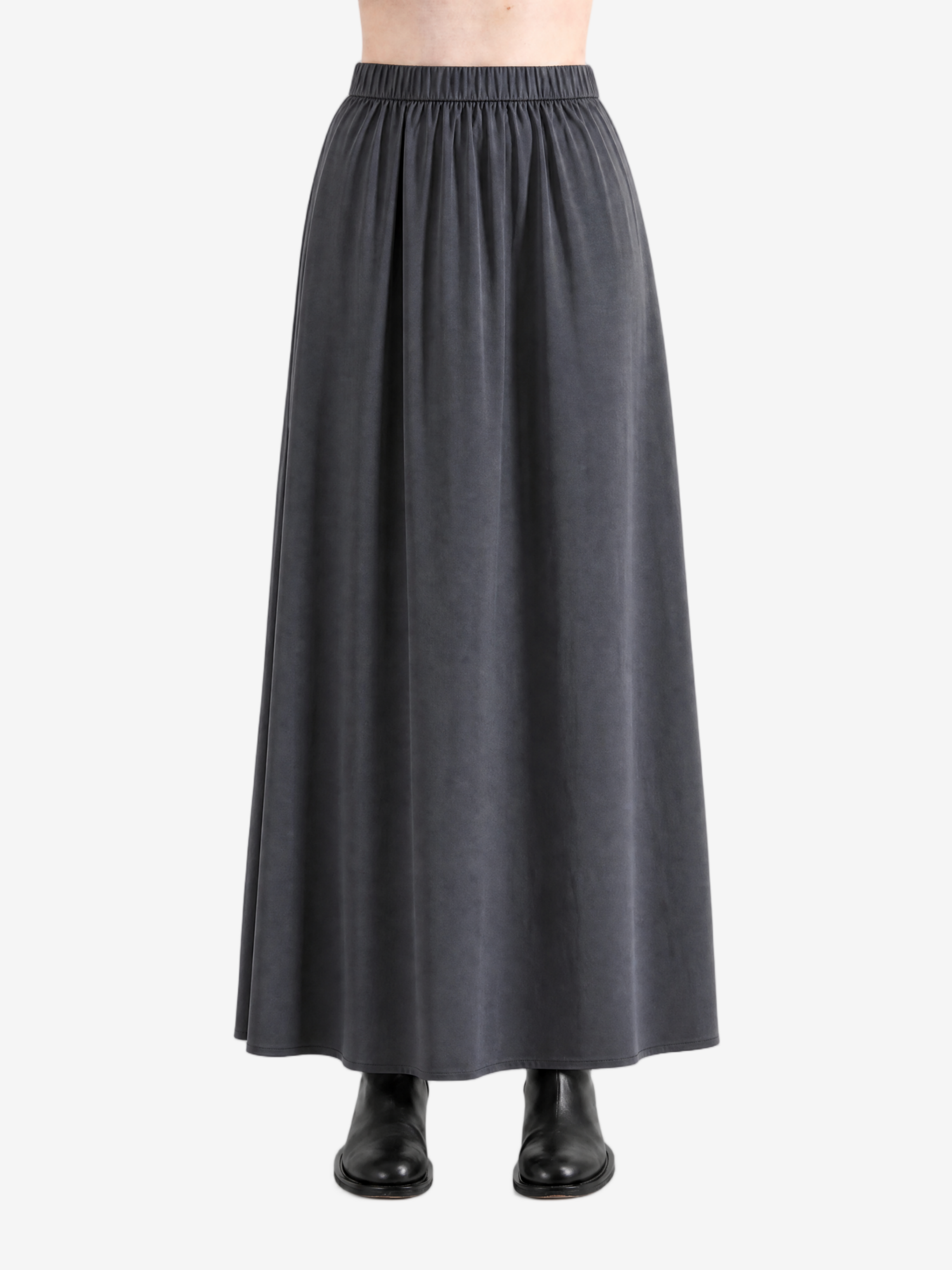 Black skirts worn by a person, showing the skirts fit