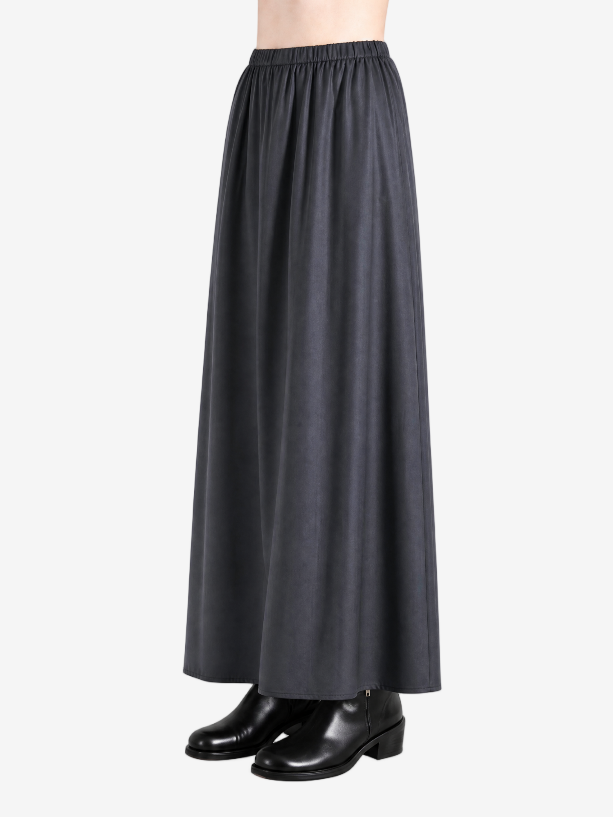 Black skirts worn by a person, showing the skirts fit