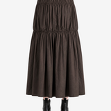 Brown skirt worn by a person, showing the skirt fit