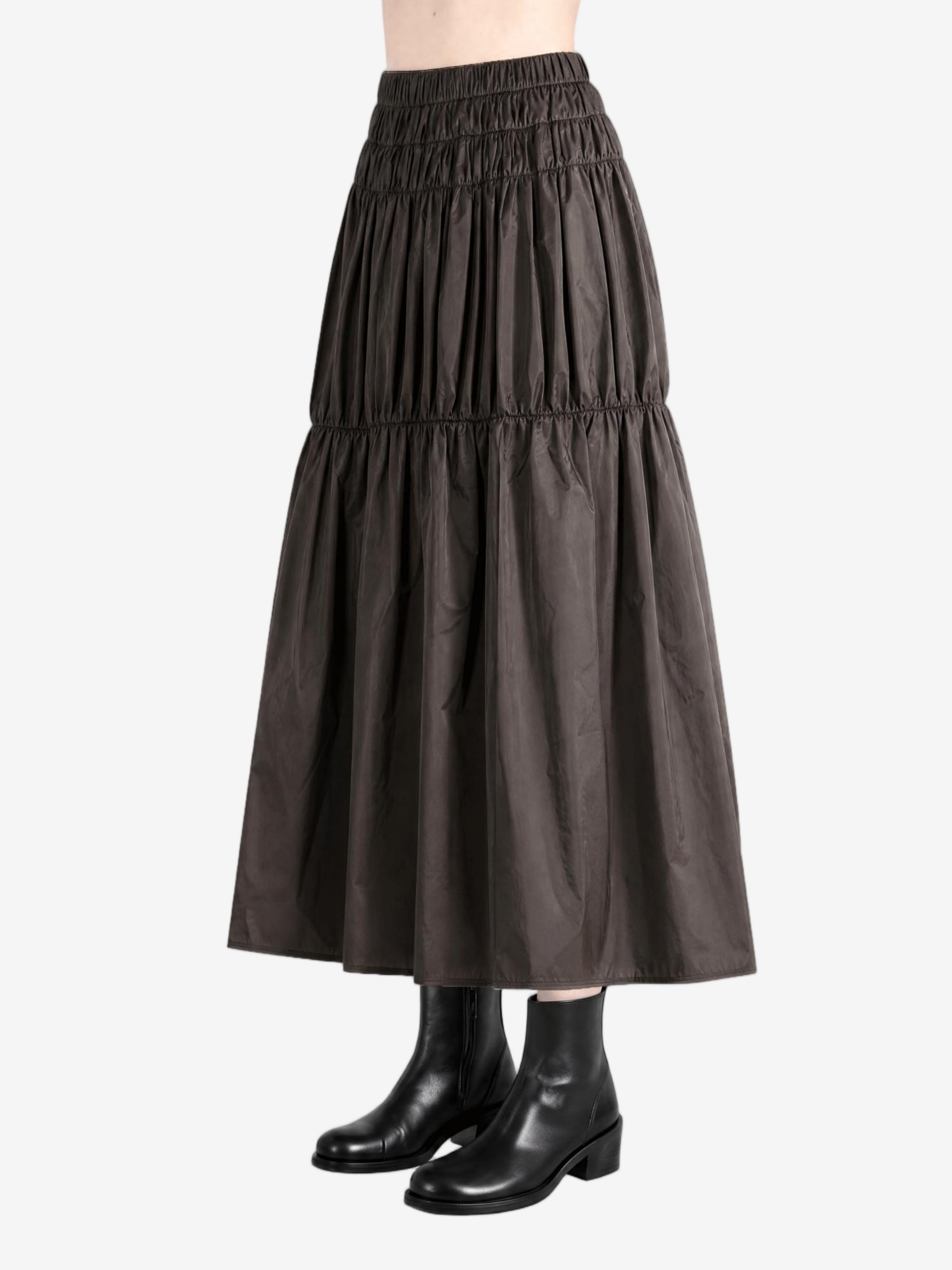 Brown skirt worn by a person, side view