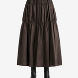Brown skirt worn by a person, back view