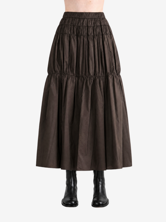 Brown skirt worn by a person, back view
