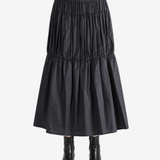 Black skirt worn by a person, showing the skirt fit