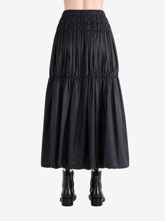 Black skirt worn by a person, back view