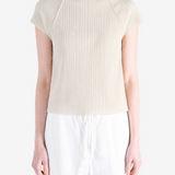 Grey tops worn by a person, showing the tops fit