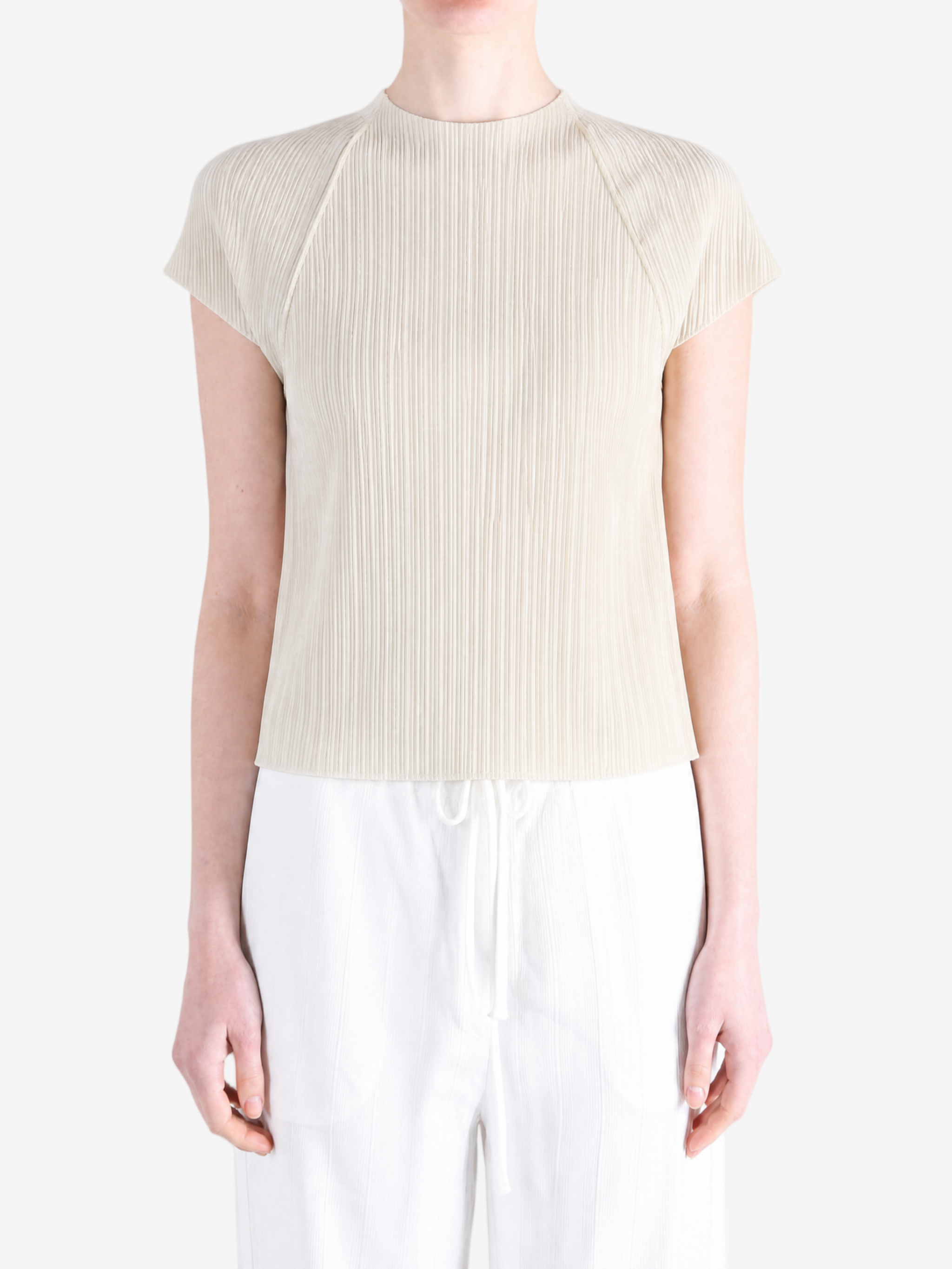 Grey tops worn by a person, showing the tops fit