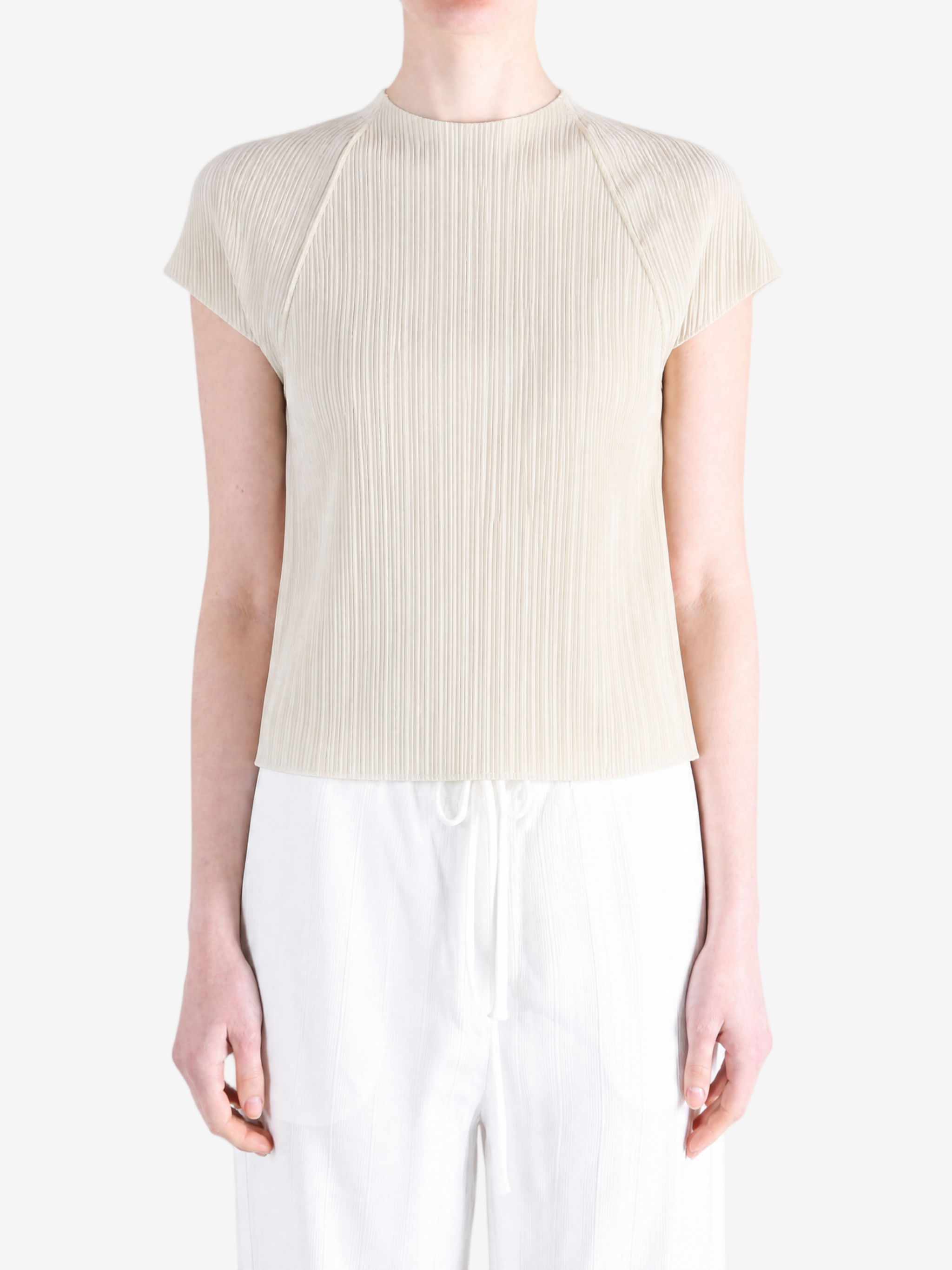 Grey tops worn by a person, showing the tops fit