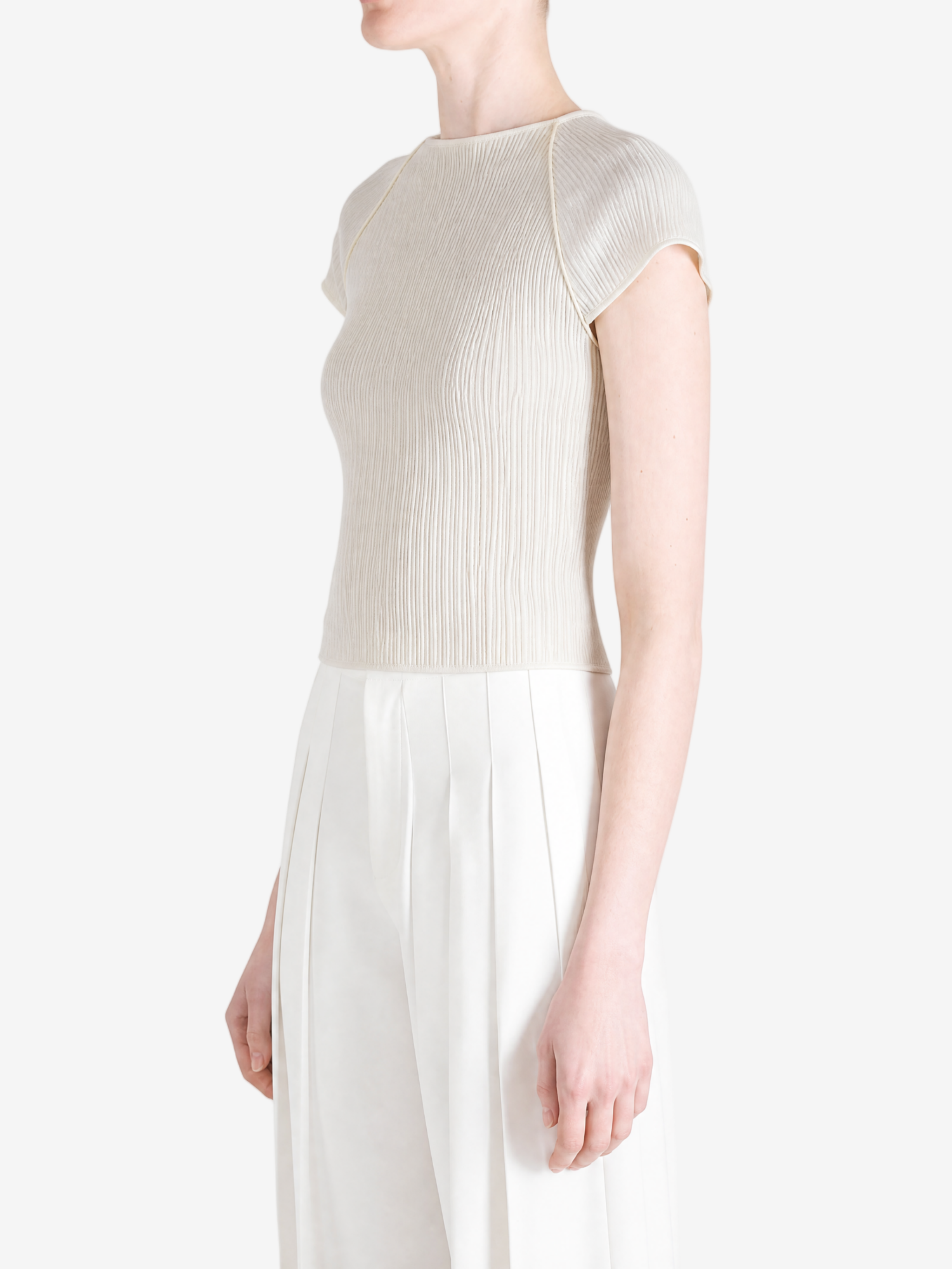 Grey tops worn by a person, showing the tops fit