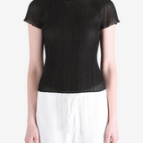 Black top worn by a person, showing the top fit