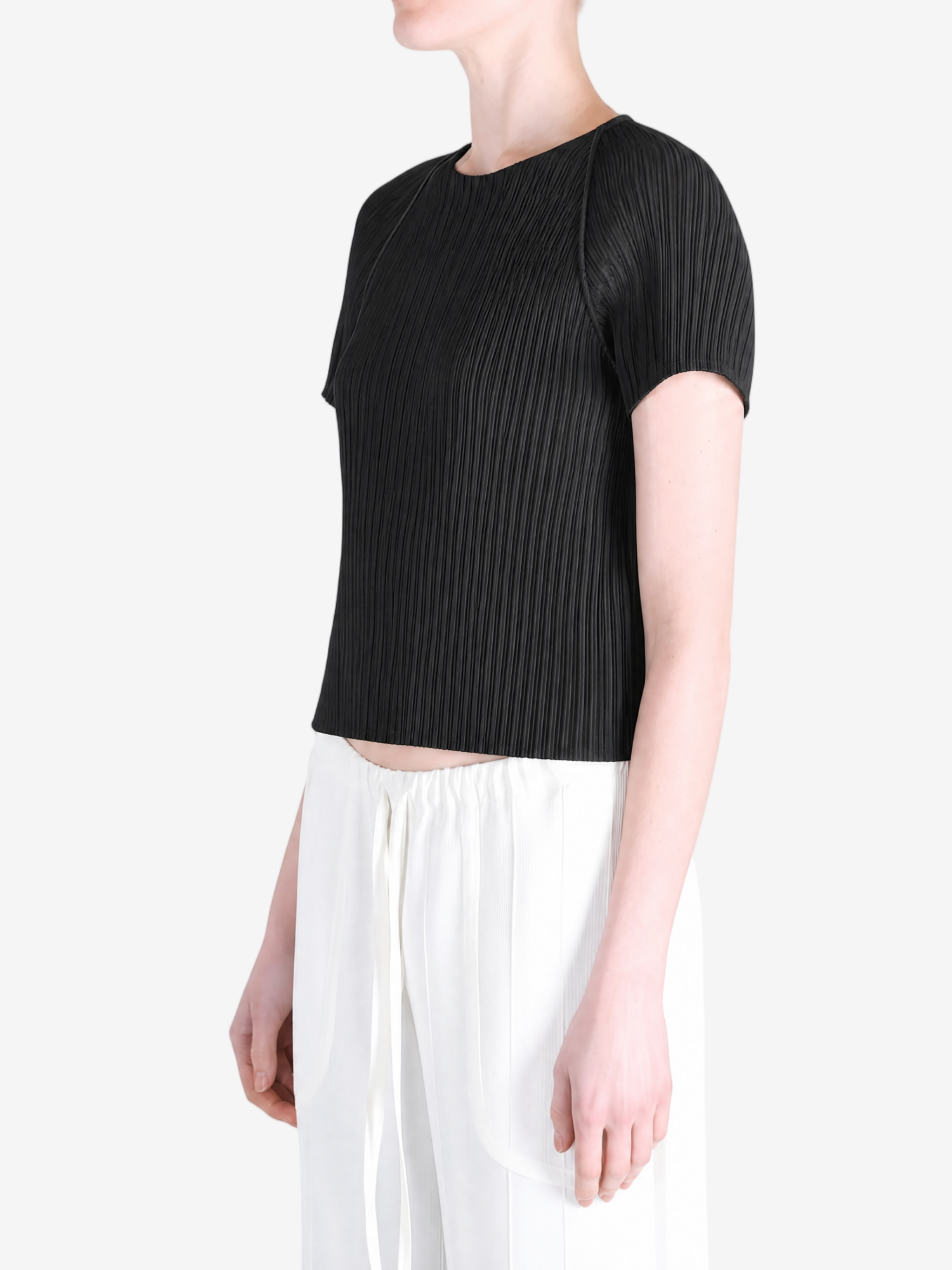 Black top worn by a person, showing the top fit