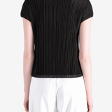 Black top worn by a person, showing the top fit