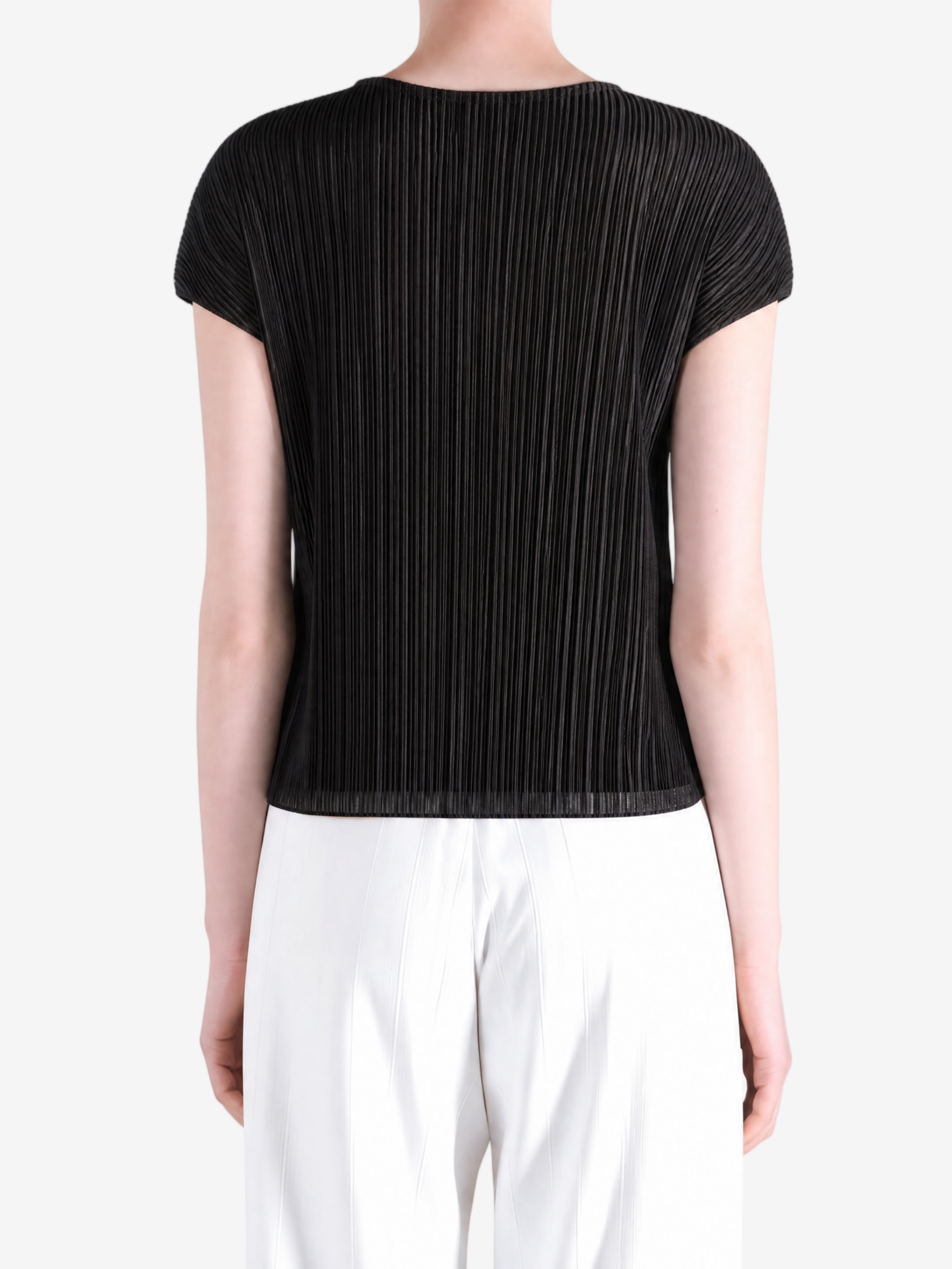 Black top worn by a person, showing the top fit