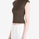 Brown top worn by a person, showing the top's fit