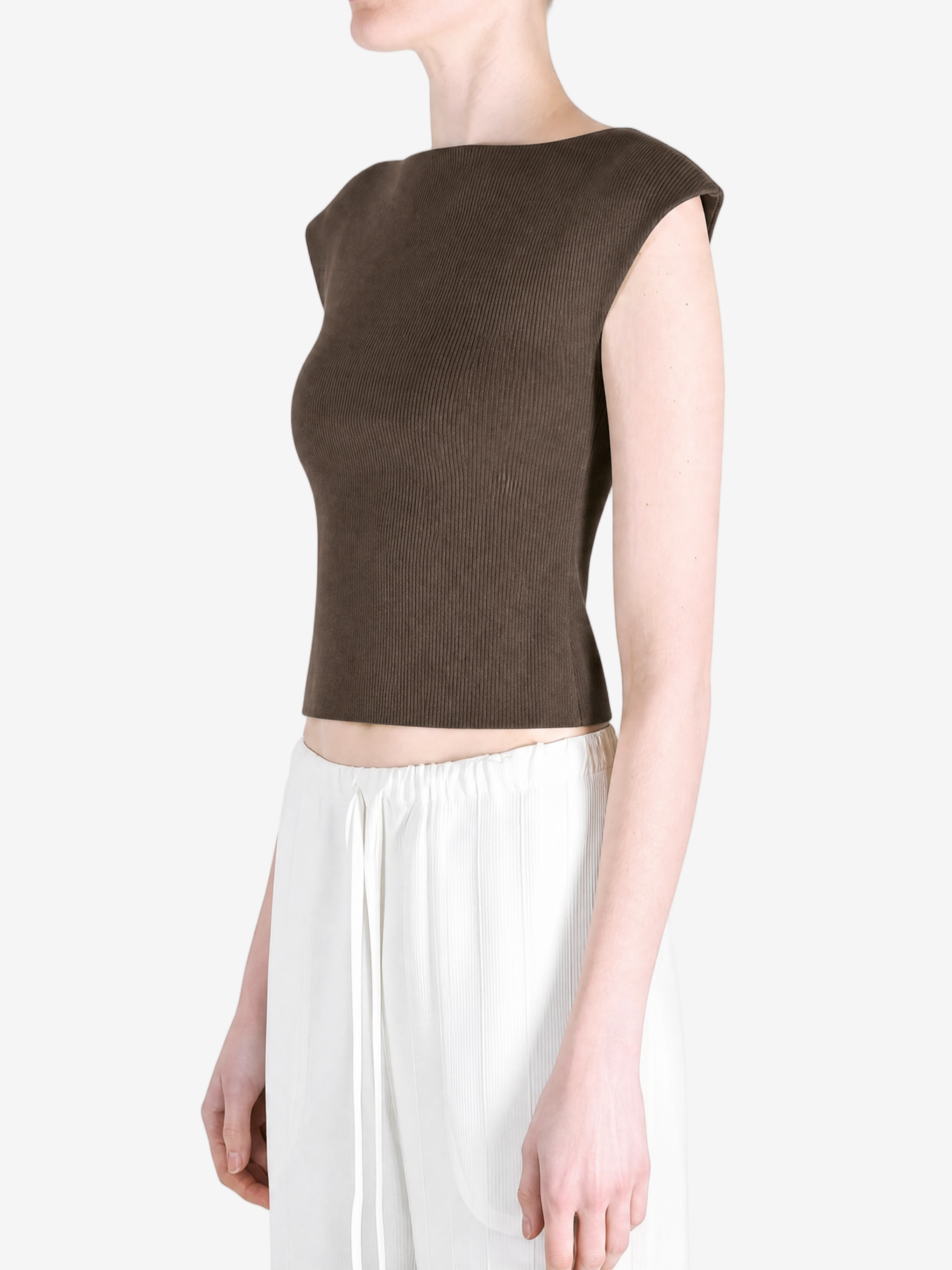 Brown top worn by a person, showing the top's fit