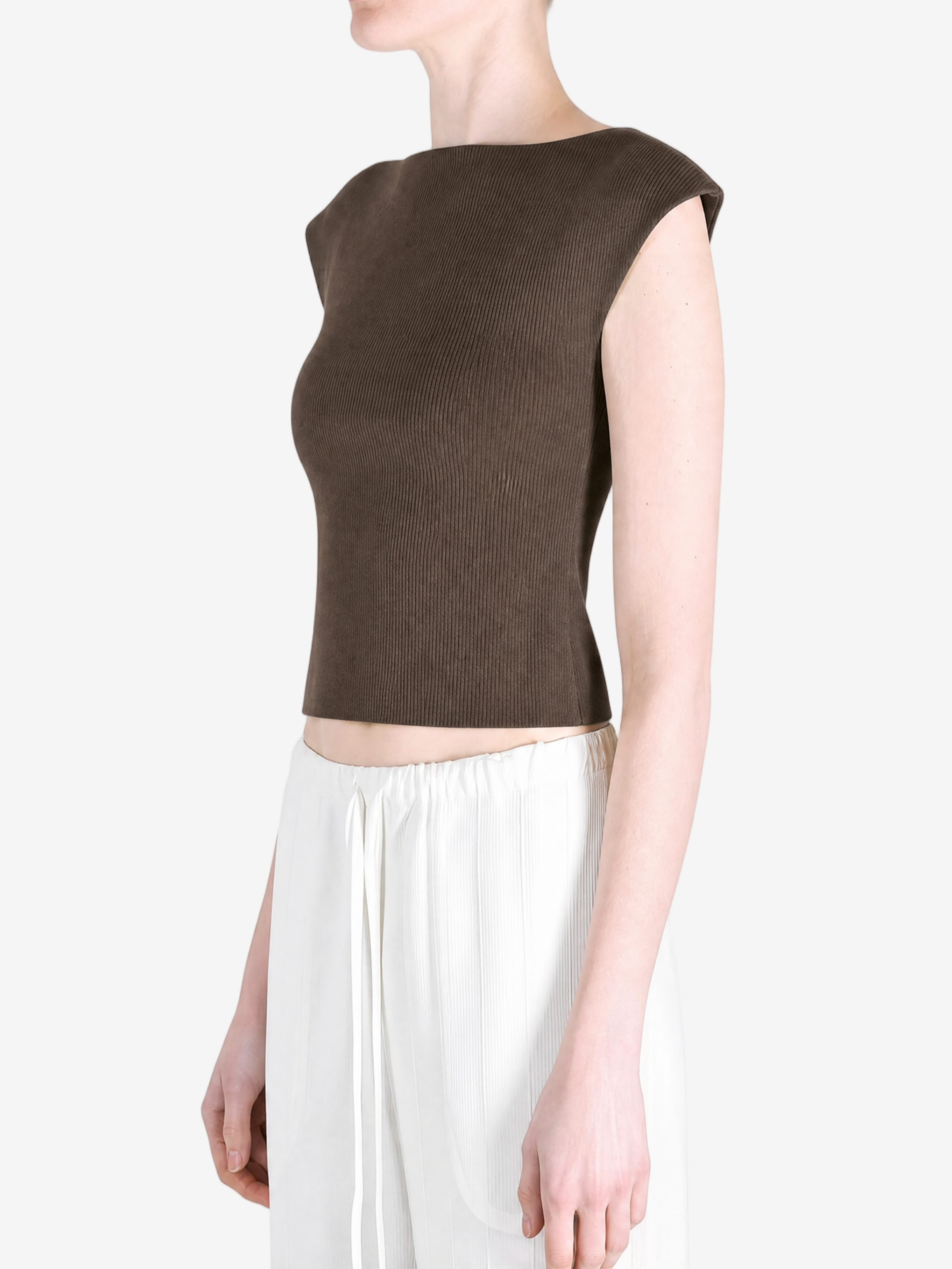 Brown top worn by a person, showing the top's fit