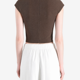 Brown top worn by a person, showing the top's fit
