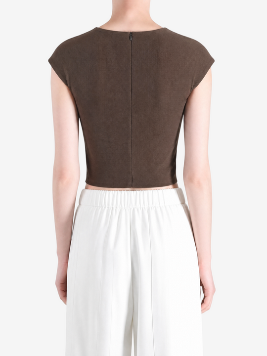 Brown top worn by a person, showing the top's fit