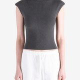 Black top worn by a person, showing the top's fit