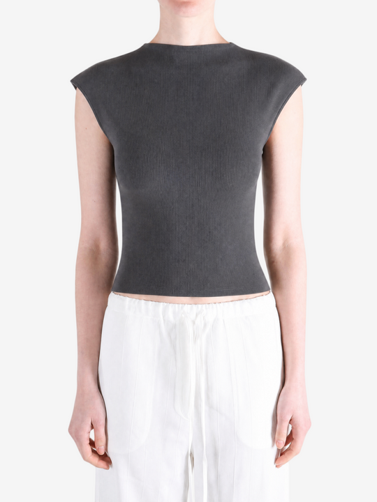 Black top worn by a person, showing the top's fit