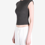 Black top worn by a person, showing the top's fit