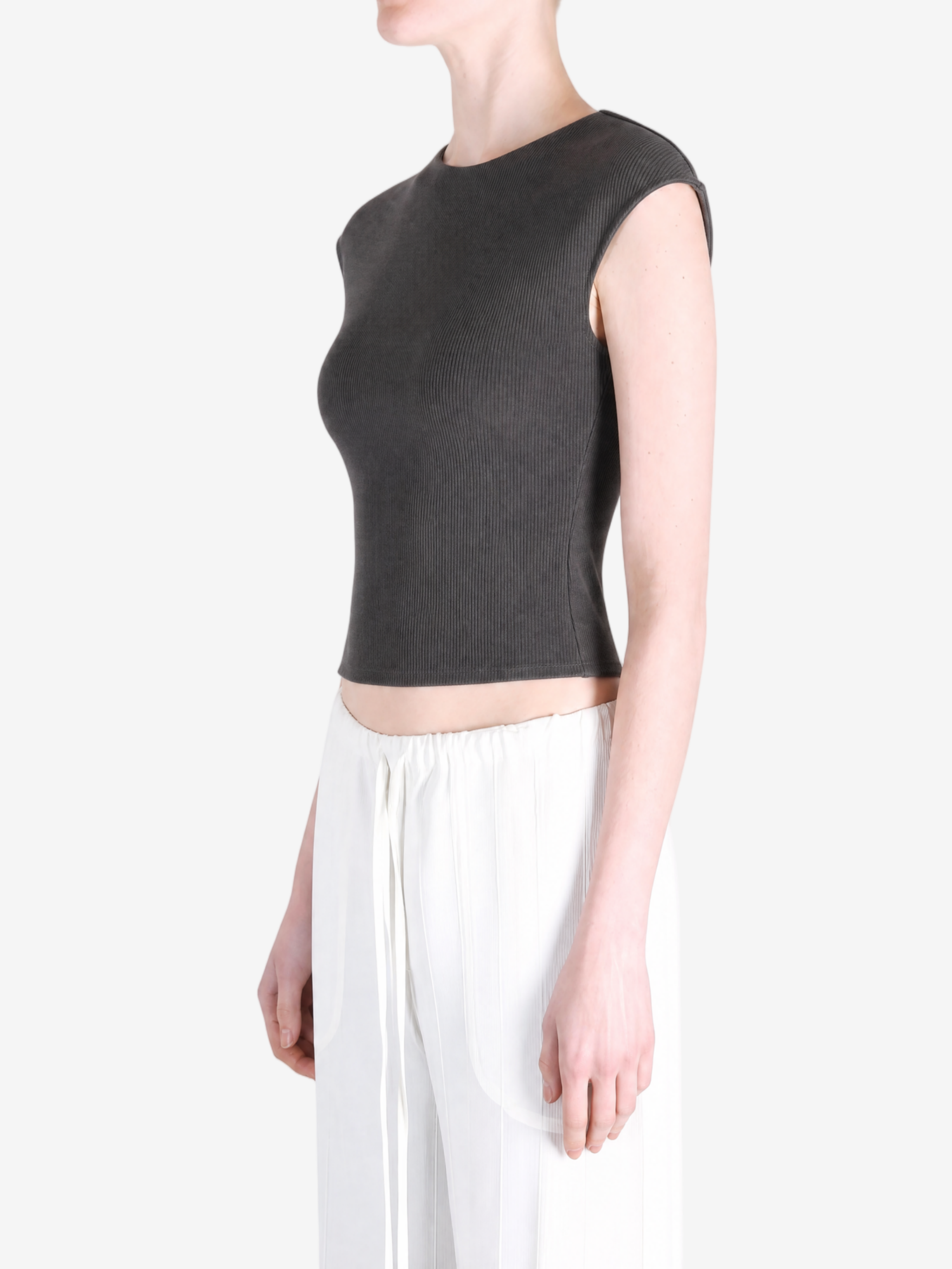 Black top worn by a person, showing the top's fit