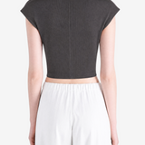 Black top worn by a person, showing the top's fit