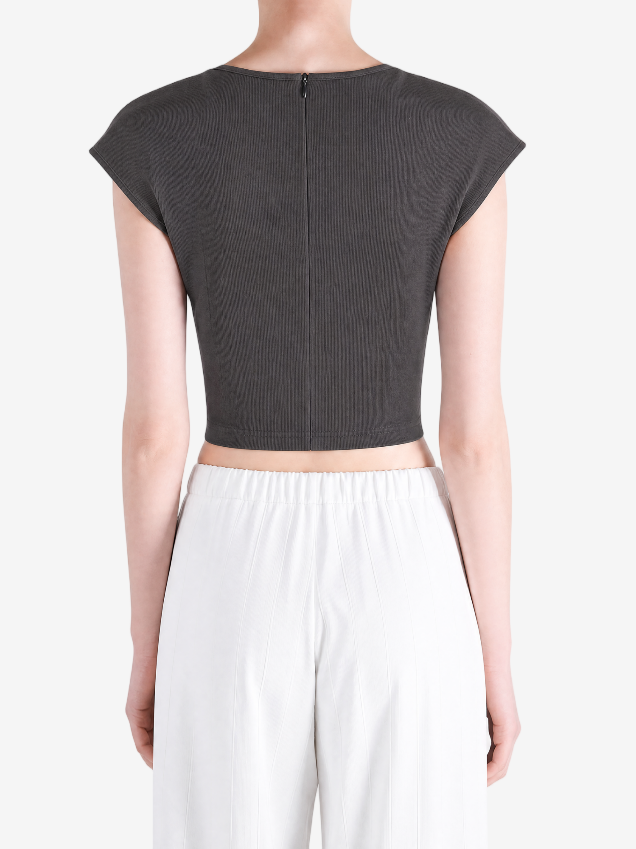 Black top worn by a person, showing the top's fit