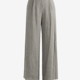 Grey pants worn by a person, showing the pants's fit