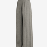 Grey pants worn by a person, showing the pants's fit