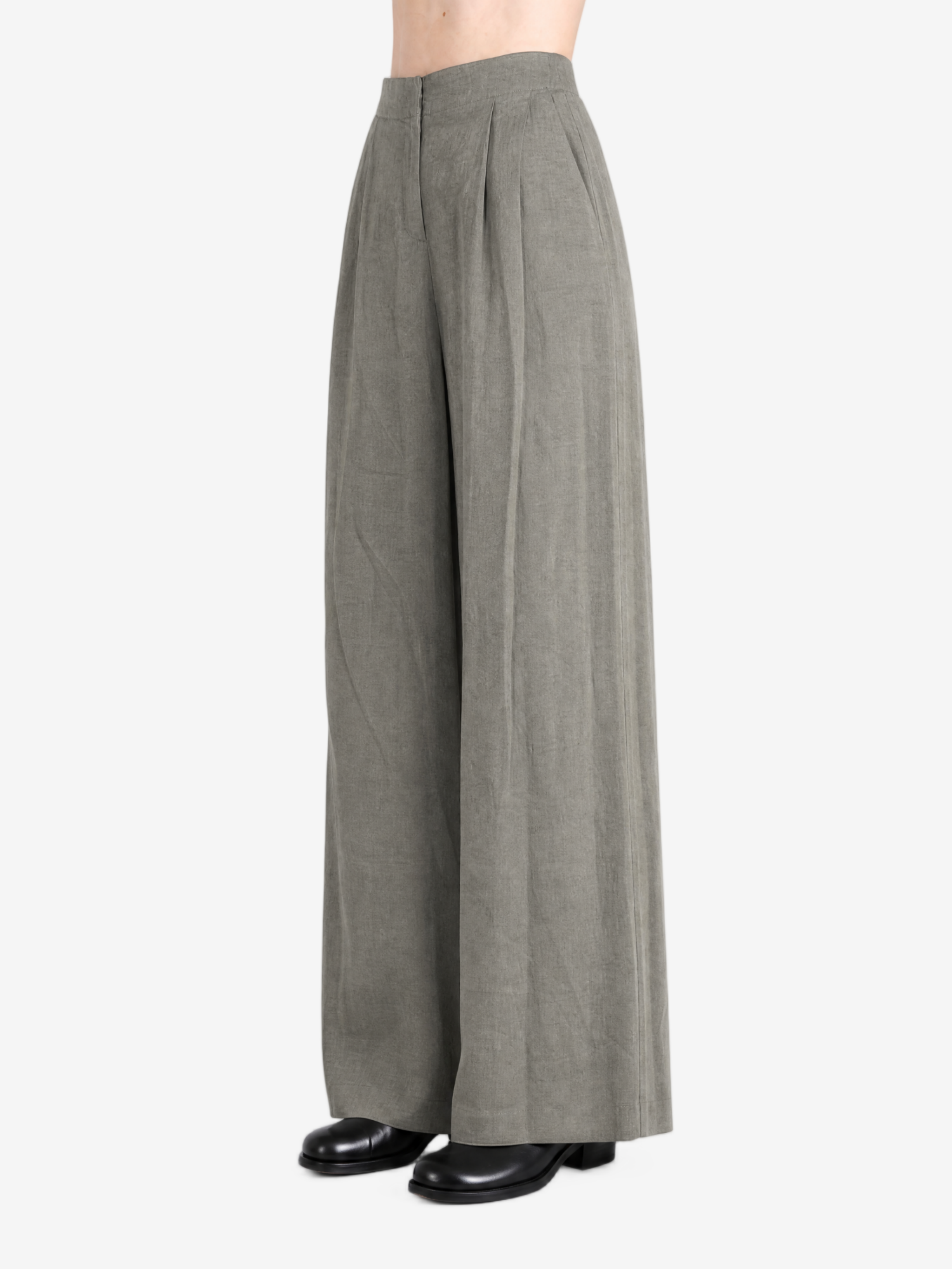Grey pants worn by a person, showing the pants's fit