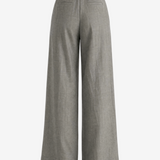 Grey pants worn by a person, showing the pants's fit