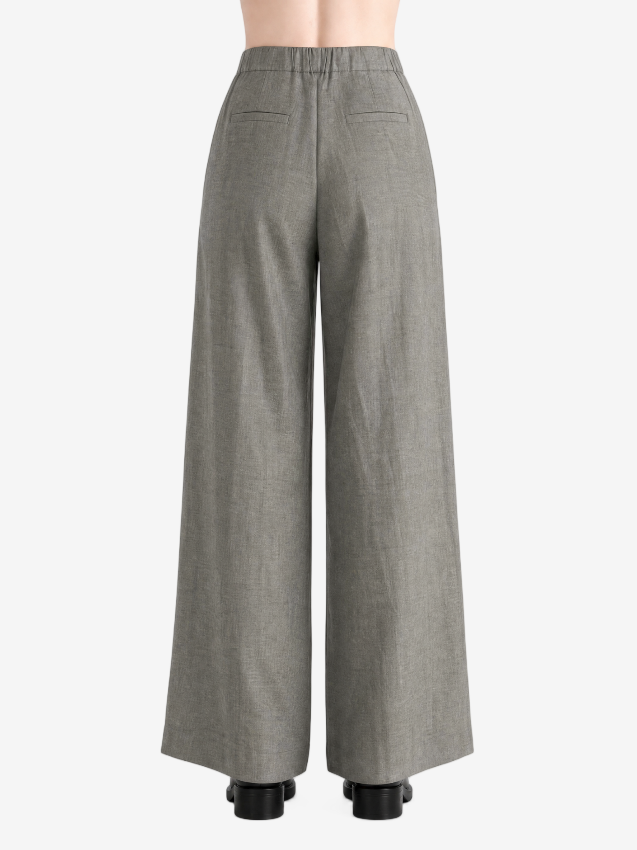 Grey pants worn by a person, showing the pants's fit