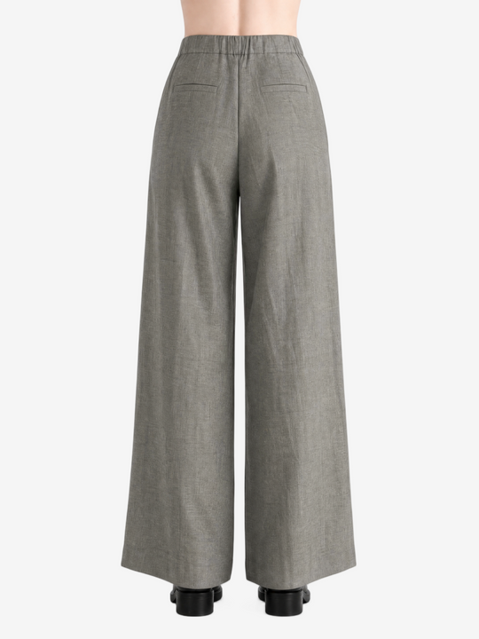 Grey pants worn by a person, showing the pants's fit