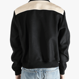 Black hoodies worn by a person, showing the hoodies fit