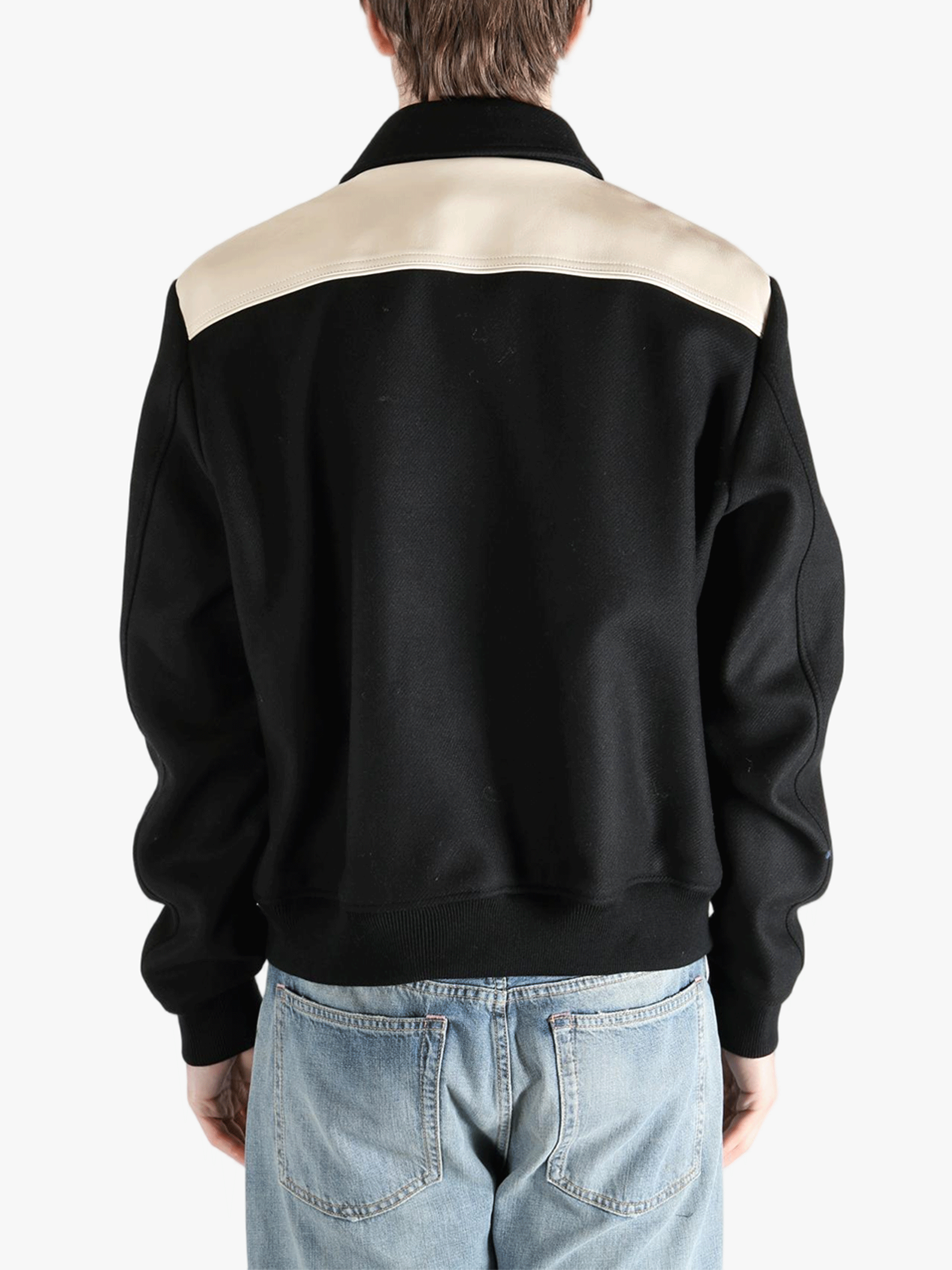 Black hoodies worn by a person, showing the hoodies fit