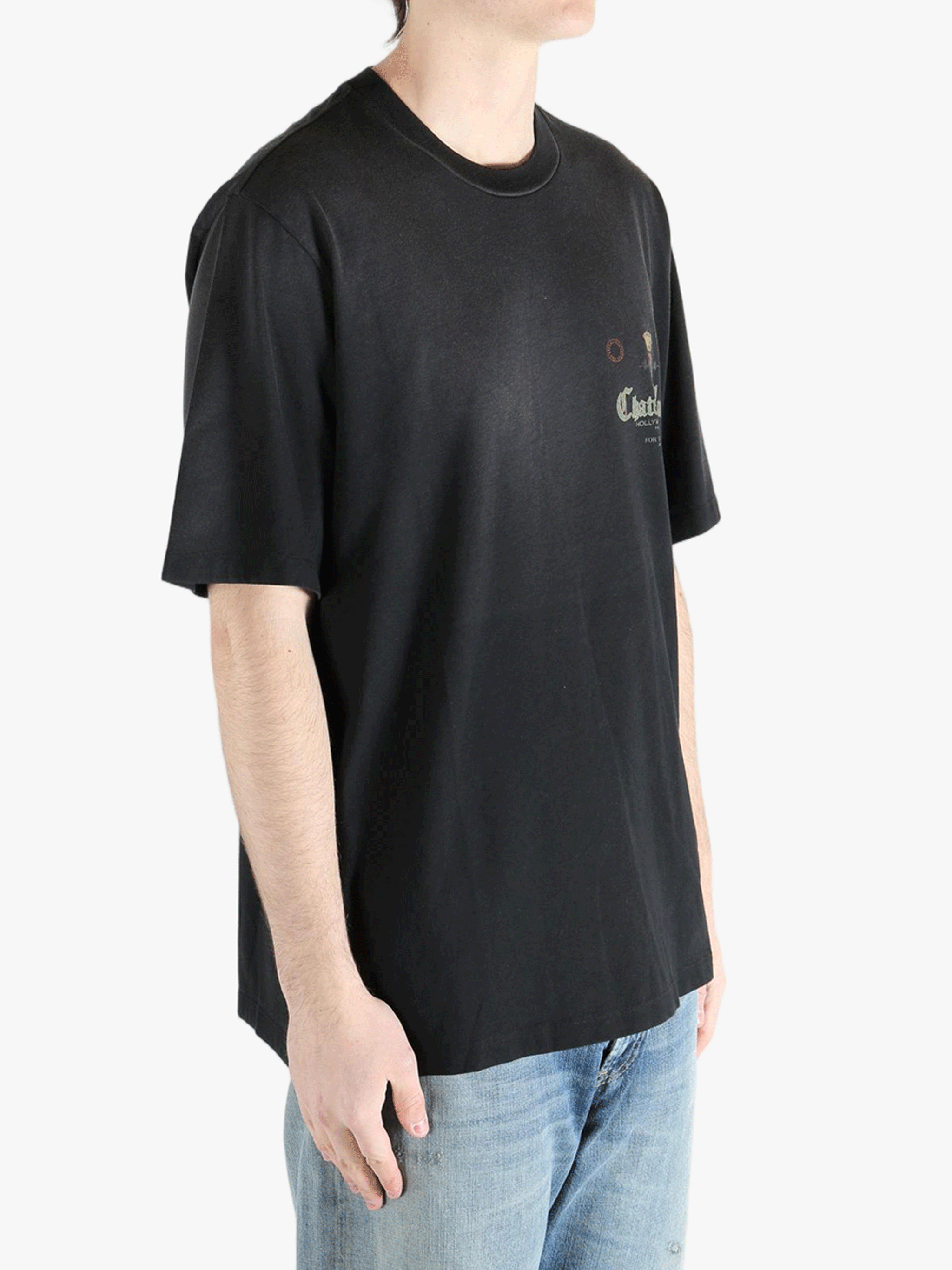 Black t-shirts worn by a person, showing the shirt's fit