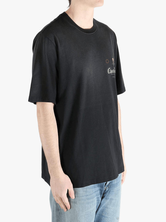 Black t-shirts worn by a person, showing the shirt's fit