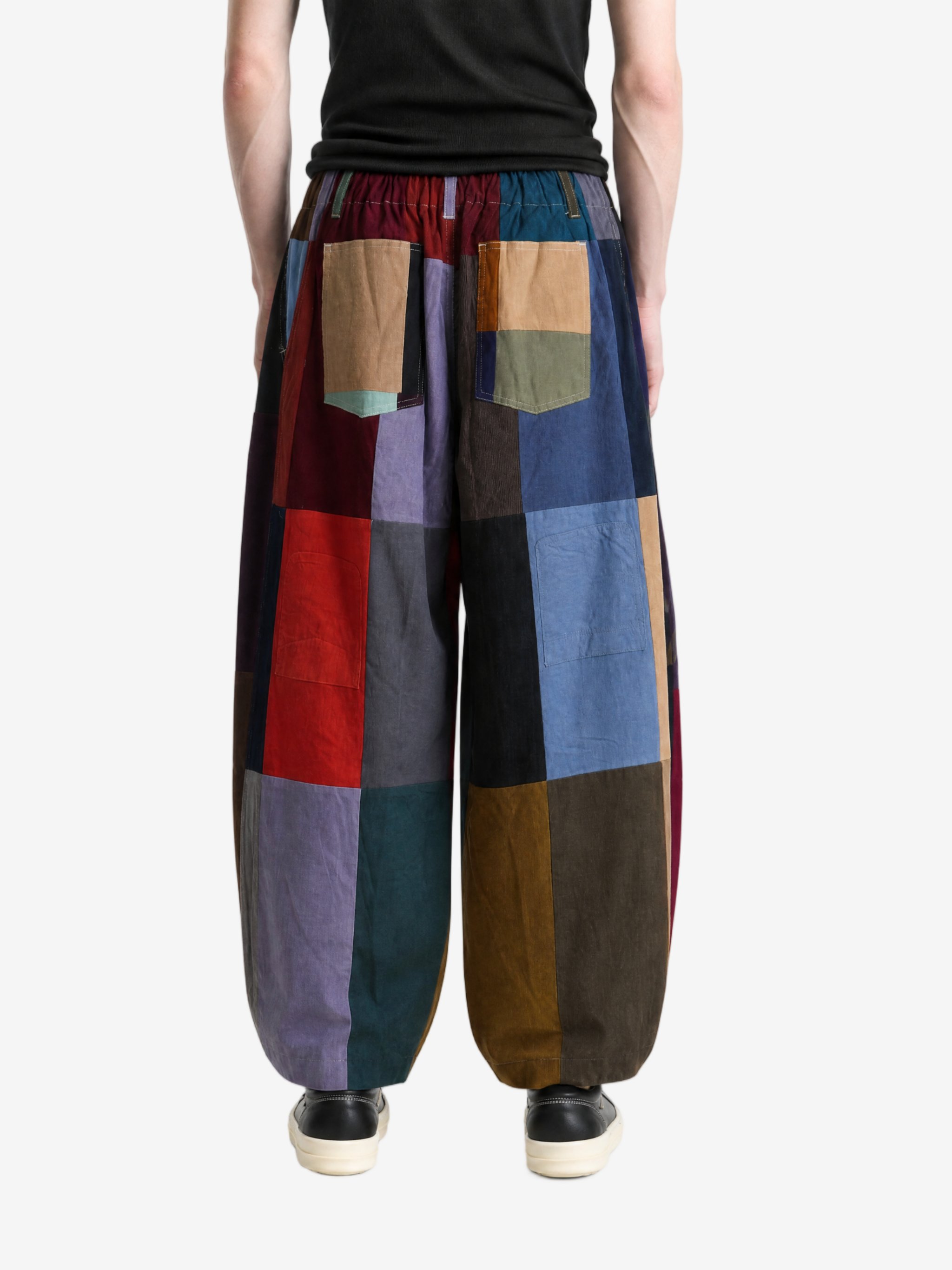 Brown pant worn by a person, showing the pant fit