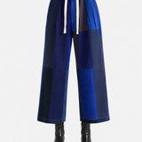 Blue pant worn by a person, showing the pant fit
