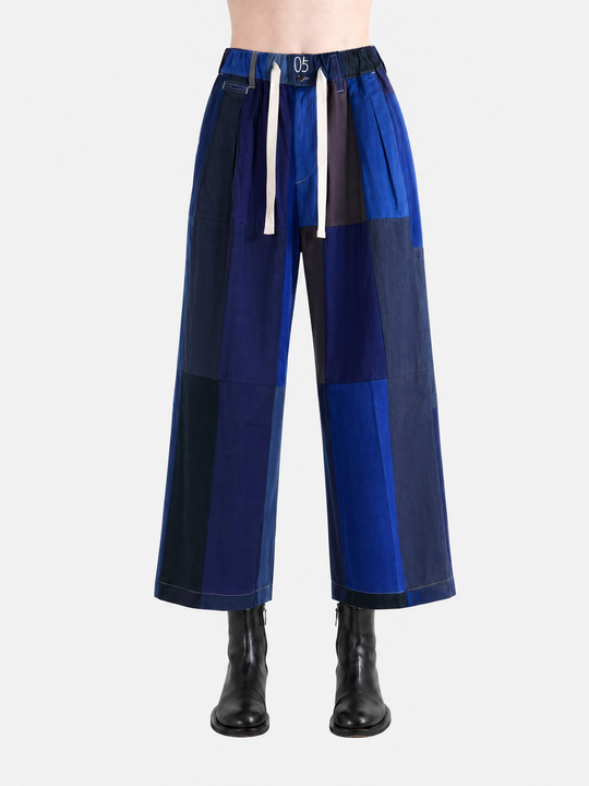 Blue pant worn by a person, showing the pant fit