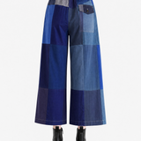 Blue pant worn by a person, showing the pant fit