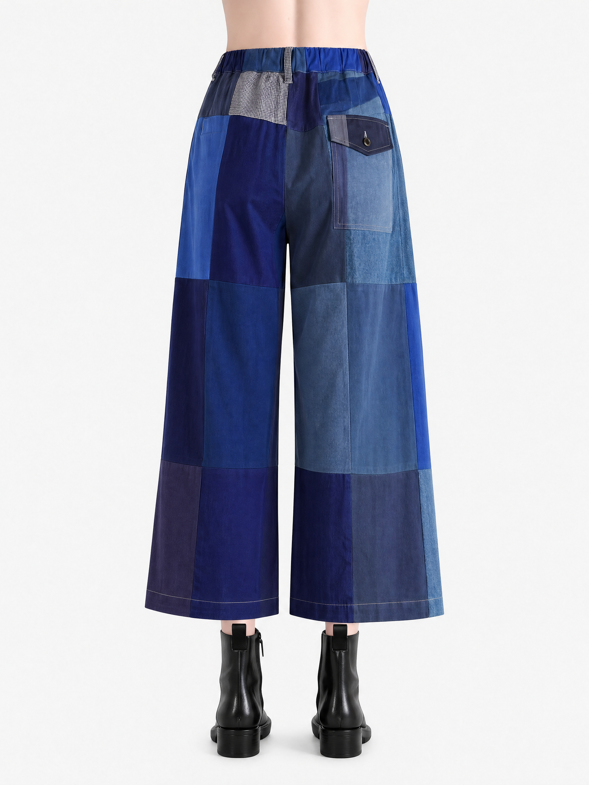 Blue pant worn by a person, showing the pant fit