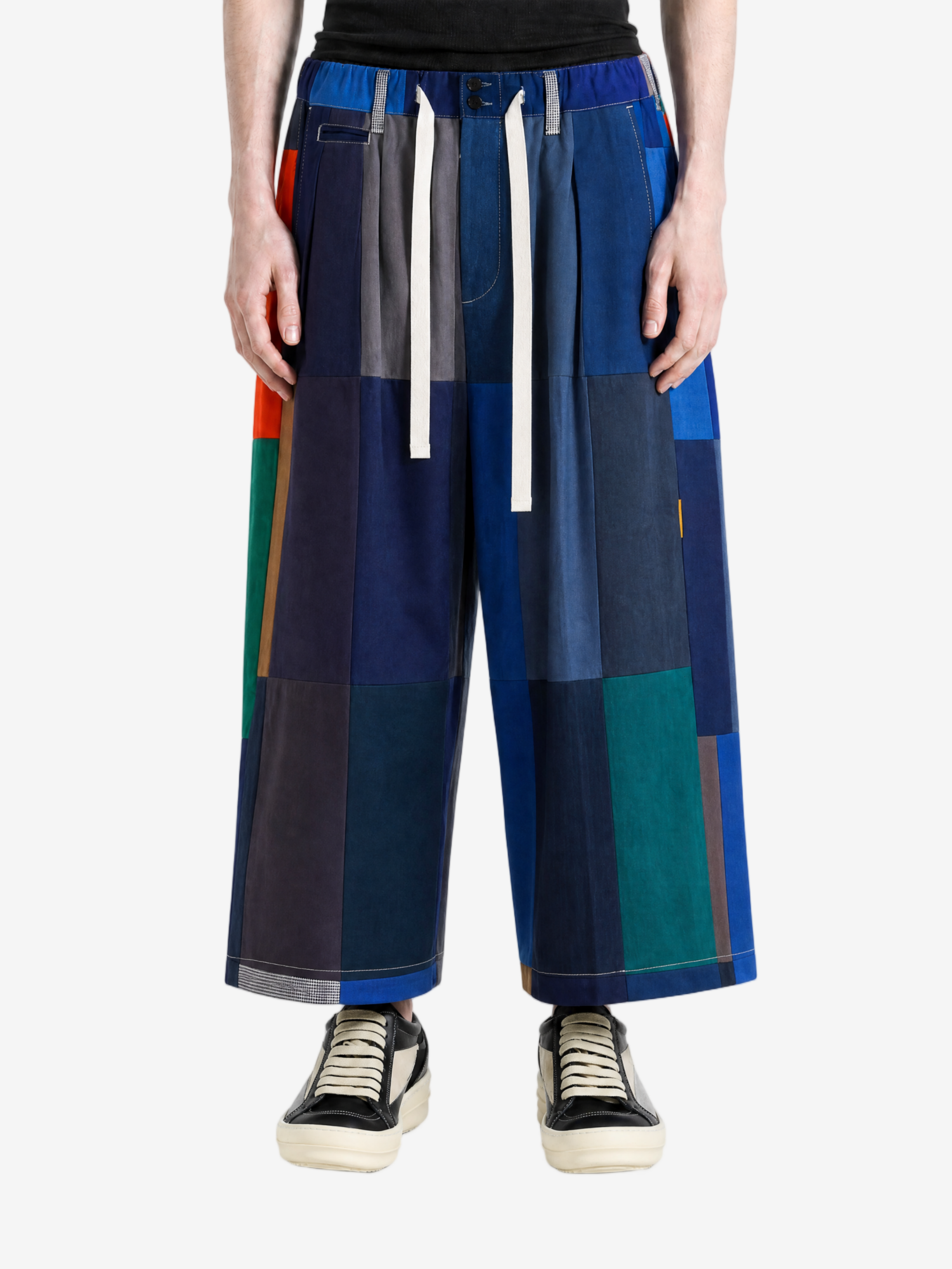 Blue pants worn by a person, showing the pants' fit.
