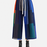 Blue pants worn by a person, showing the pants' fit.