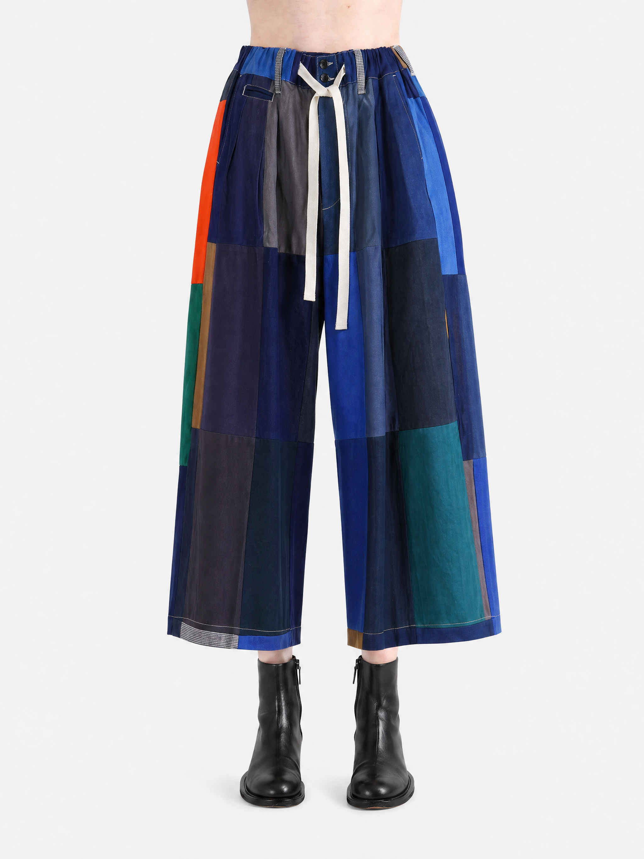 Blue pants worn by a person, showing the pants' fit.
