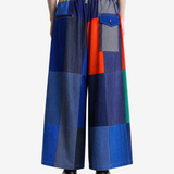 Blue pants worn by a person, showing the pants' fit.