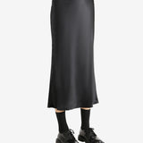 Black skirt worn by a person, showing the skirt's fit